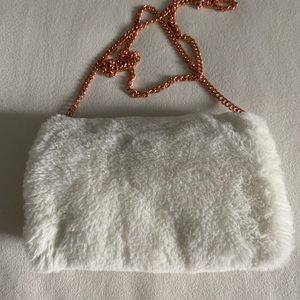 Fuzzy purse with rose gold chains